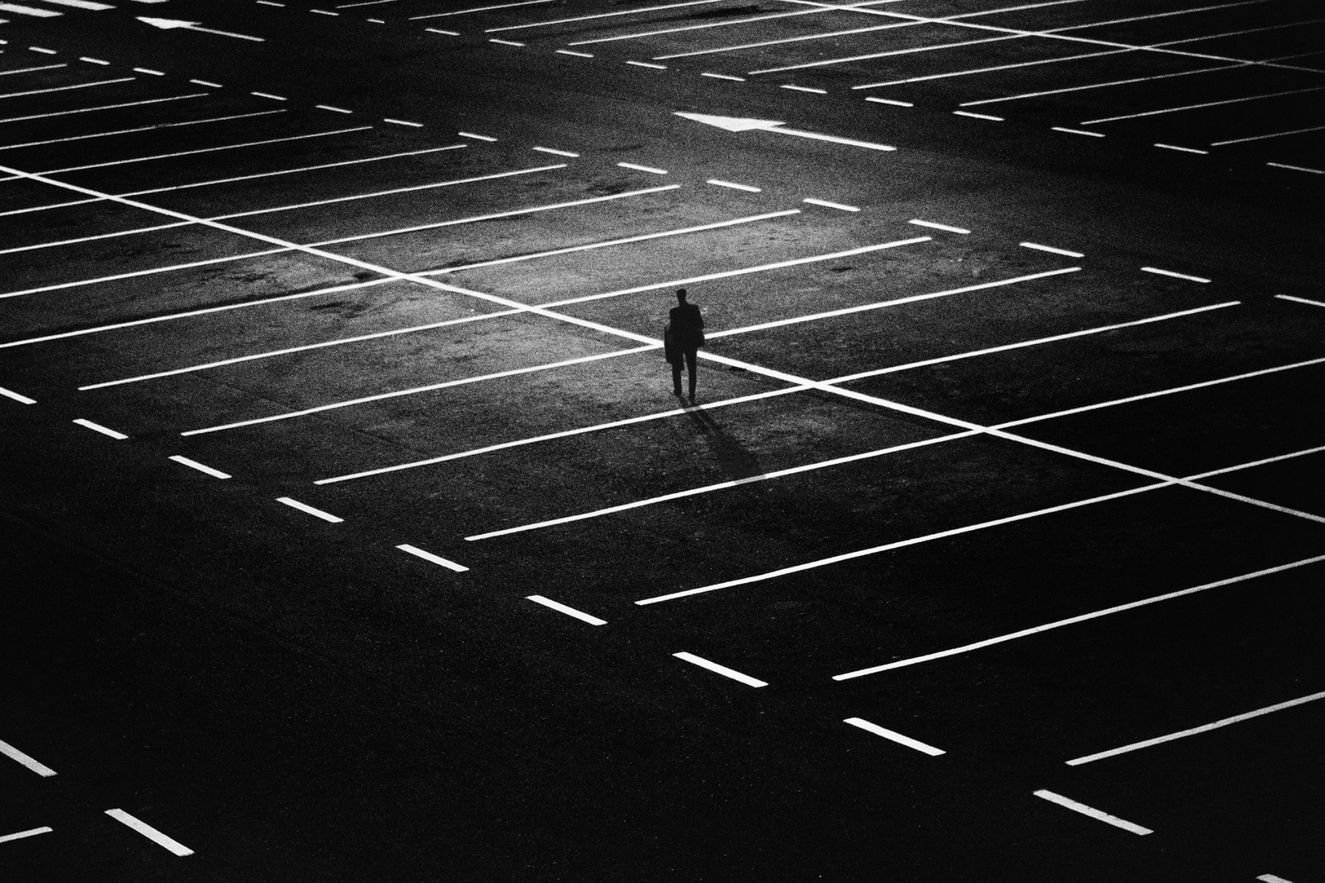 Man walking alone in car park